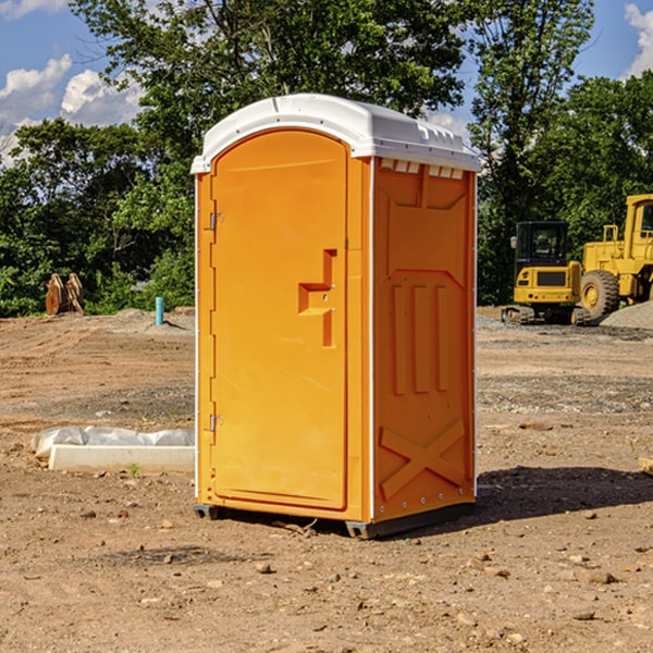 what is the cost difference between standard and deluxe portable restroom rentals in Pointblank Texas